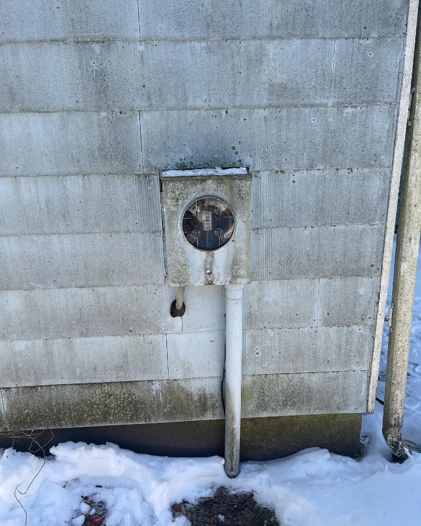 Old failing meter in snow
